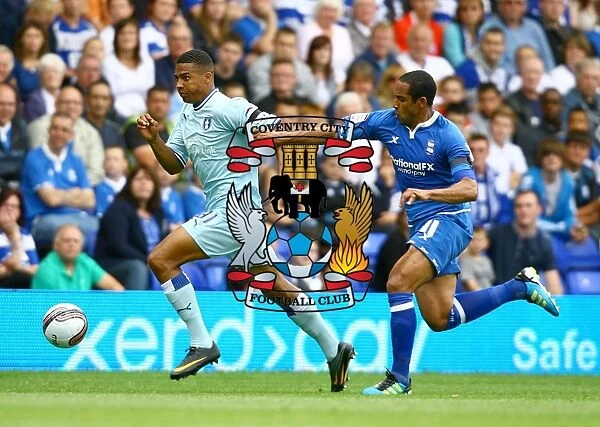 Cyrus Christie vs Jean Beausejour: Tense Moment in Birmingham City vs Coventry City Football Match