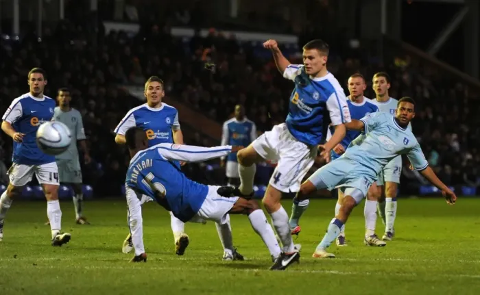 Framed Print : Cyrus Christie's Thunderous Goal Attempt vs. Peterborough United (17-12-2011) Framed Print : Cyrus Christie's Thunderous Goal Attempt vs. Peterborough United (17-12-2011)