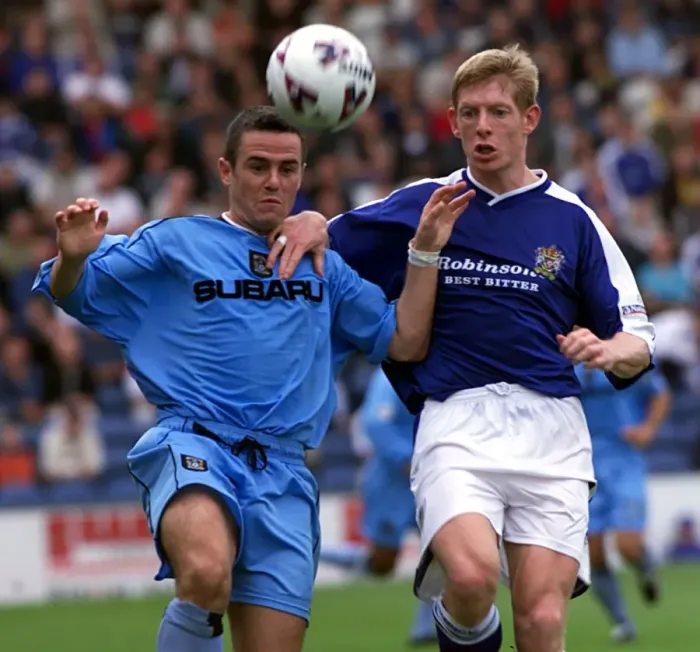 Framed Print : David Thompson of Coventry City Holds Off Stockport's Peter Clark in Intense Nationwide League Face-off