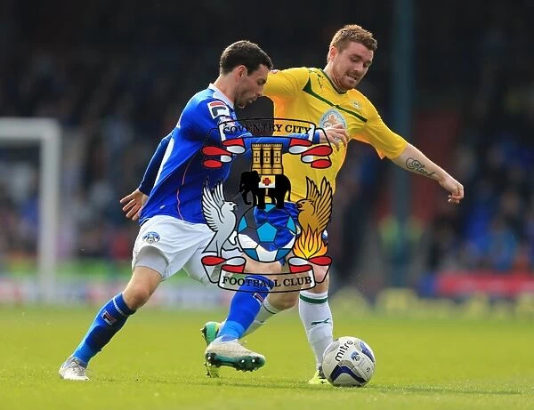 David Worrall vs. John Fleck: A Riveting Rivalry in Oldham Athletic vs. Coventry City's League One Clash (April 2014)