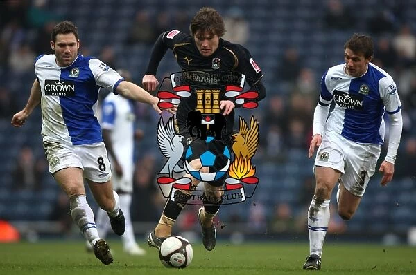 Fifth Round FA Cup Clash: Aron Gunnarsson of Coventry City vs. Blackburn Rovers David Dunn and Stephen Warnock (2009)