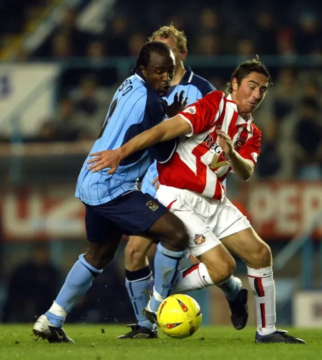 Framed Print : A Fight for Supremacy: Coventry City vs. Sunderland - Intense Rivalry on the Division One Field: Patrick Suffo vs. Tommy Smith Framed Print : A Fight for Supremacy: Coventry City vs. Sunderland - Intense Rivalry on the Division One Field: Patrick Suffo vs. Tommy Smith