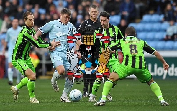 Gary Deegan's Determined Attempt to Penetrate Brighton's Defence in Coventry City vs Brighton Npower Championship Match