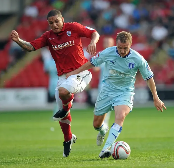 Framed Print : Gary McSheffrey vs. Nathan Doyle: Intense Battle for Ball Possession in Coventry City's Npower Championship Clash at Barnsley's Oakwell Stadium Framed Print : Gary McSheffrey vs. Nathan Doyle: Intense Battle for Ball Possession in Coventry City's Npower Championship Clash at Barnsley's Oakwell Stadium