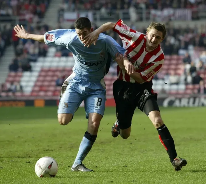 Framed Print : George McCartney vs. Richard Duffy: Intense Rivalry in the Championship Clash between Sunderland and Coventry City (Stadium of Light, 17-03-2005) Framed Print : George McCartney vs. Richard Duffy: Intense Rivalry in the Championship Clash between Sunderland and Coventry City (Stadium of Light, 17-03-2005)