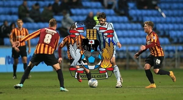 Intense Action: Coventry City's Adam Barton Faces Off Against Bradford City Opponents in Sky Bet League One