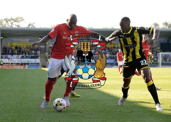 Intense Battle: Binnom-Williams vs. Fortune - Sky Bet League One Tackle Showdown between Burton Albion and Coventry City