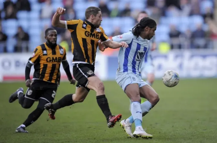 Framed Print : Intense Battle: Dominic Samuel vs Michael Brown - Coventry City's Sky Bet League One Showdown with Port Vale Framed Print : Intense Battle: Dominic Samuel vs Michael Brown - Coventry City's Sky Bet League One Showdown with Port Vale