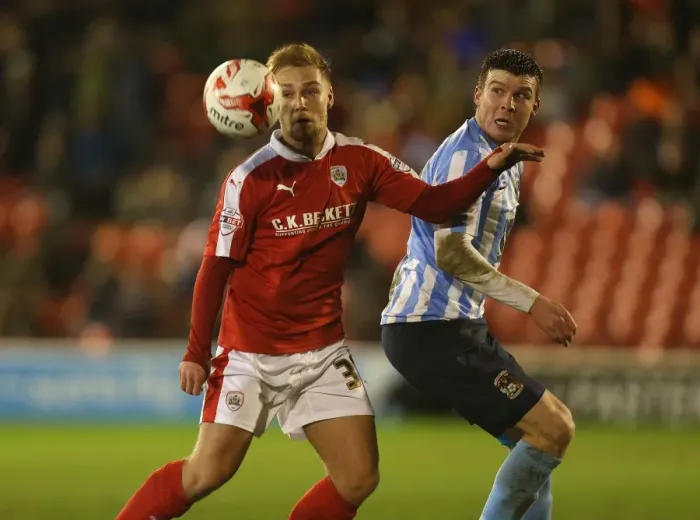 Framed Print : Intense Battle for Possession: Harry Chapman vs Chris Stokes in Sky Bet League One Clash (Barnsley vs Coventry City)