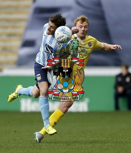Intense Moment: Coventry City vs Millwall - Clash Between Romain Vincelot and Chris Taylor at Ricoh Arena