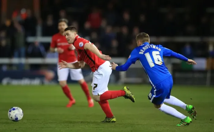 Framed Print : Intense Moment: John Fleck Charges Towards Harry Beautyman in Sky Bet League One Match at ABAX Stadium Framed Print : Intense Moment: John Fleck Charges Towards Harry Beautyman in Sky Bet League One Match at ABAX Stadium