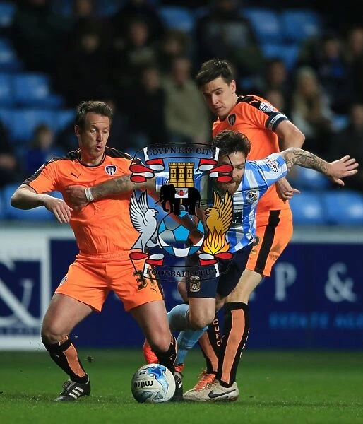 Intense Moment: Romain Vincelot of Coventry City Charges Forward Against Nicky Shorey and Owen Garvan of Colchester United at Ricoh Arena