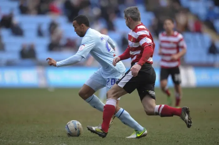 Framed Print : Intense Rivalry: Callum Wilson vs. Andy Griffin - Coventry City vs. Doncaster Rovers, Npower League One at Ricoh Arena Framed Print : Intense Rivalry: Callum Wilson vs. Andy Griffin - Coventry City vs. Doncaster Rovers, Npower League One at Ricoh Arena
