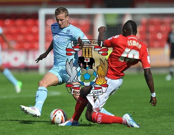 Intense Rivalry: Carl Baker vs Abdul Osman in Coventry City's Npower League One Clash at Crewe Alexandra (September 1, 2012)