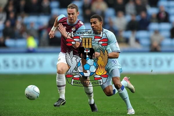 Intense Rivalry: Cyrus Christie vs. Kevin Nolan Battle for Ball (Npower Championship, Coventry City vs. West Ham United, 19-11-2011)