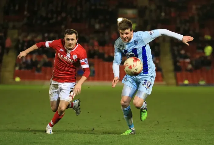 Framed Print : Intense Rivalry: A Football Battle - Scowen vs Stokes (Sky Bet League One: Barnsley vs Coventry City, Oakwell)