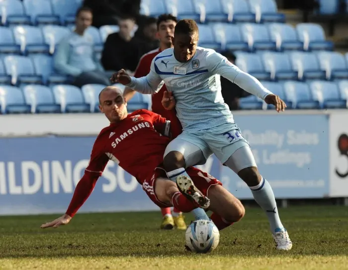 Framed Print : Intense Rivalry: Franck Moussa vs. Alan McCormack's Fierce Tackle in Coventry City vs. Swindon Town (Npower League One, 02-03-2013) Framed Print : Intense Rivalry: Franck Moussa vs. Alan McCormack's Fierce Tackle in Coventry City vs. Swindon Town (Npower League One, 02-03-2013)