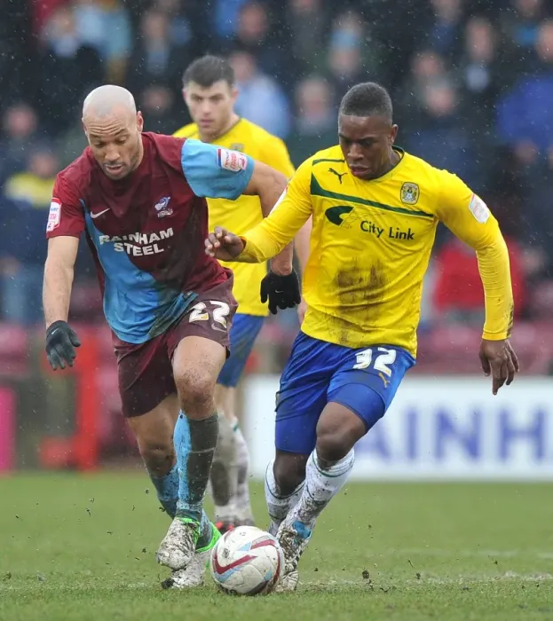 Framed Print : Intense Rivalry: Franck Moussa vs. Karl Hawley at Glanford Park - Coventry City vs. Scunthorpe United (Npower League One, March 2013) Framed Print : Intense Rivalry: Franck Moussa vs. Karl Hawley at Glanford Park - Coventry City vs. Scunthorpe United (Npower League One, March 2013)