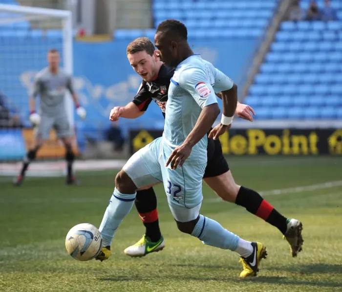 Framed Print : Intense Rivalry: Franck Moussa vs. Lee Hodson in Coventry City vs. Brentford Football League One Clash Framed Print : Intense Rivalry: Franck Moussa vs. Lee Hodson in Coventry City vs. Brentford Football League One Clash
