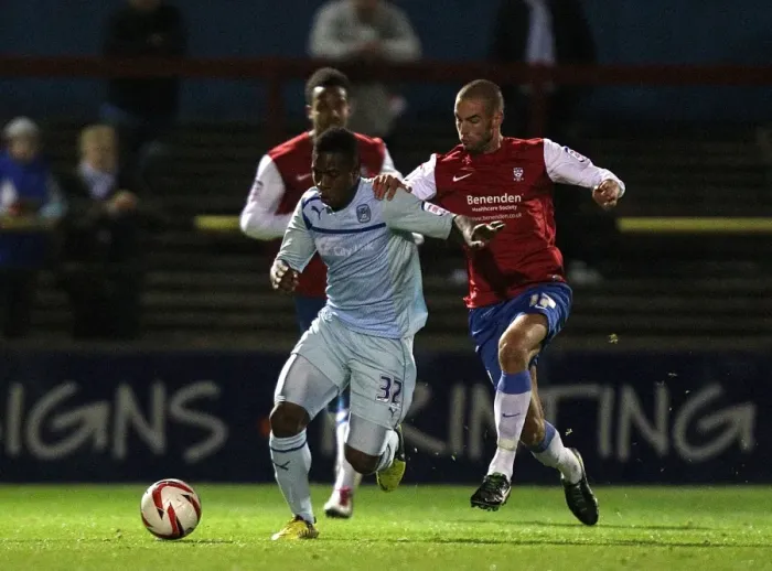 Framed Print : Intense Rivalry: Franck Moussa vs Matty Blair in the Johnstones Paint Trophy Northern Section Clash between Coventry City and York City Framed Print : Intense Rivalry: Franck Moussa vs Matty Blair in the Johnstones Paint Trophy Northern Section Clash between Coventry City and York City