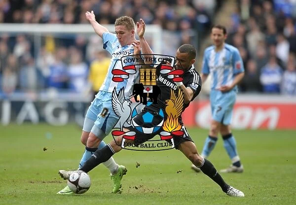 Intense Rivalry: Freddy Eastwood vs. Jose Bosingwa's Epic Battle for the Ball in Coventry City's FA Cup Sixth Round Clash against Chelsea (7th March 2009)