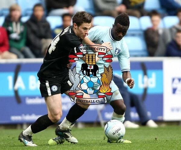 Intense Rivalry: Gael Bigirimana vs. Tommy Rowe Clash at Coventry City vs. Peterborough United, Championship Match (07-04-2012)
