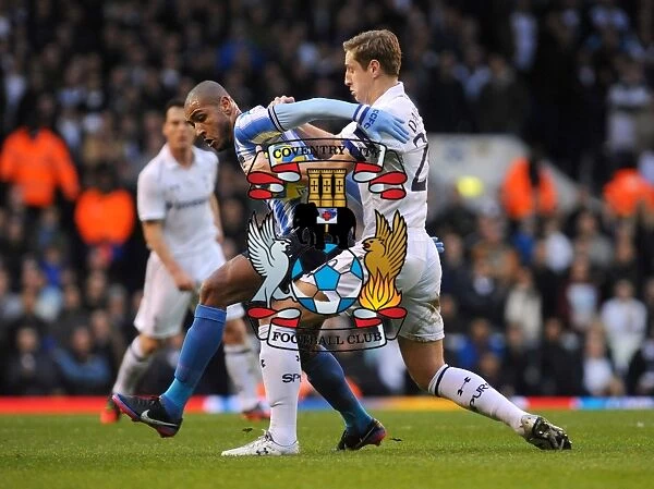 Intense Rivalry: Leon Clarke vs Michael Dawson in FA Cup Third Round Clash between Coventry City and Tottenham Hotspur