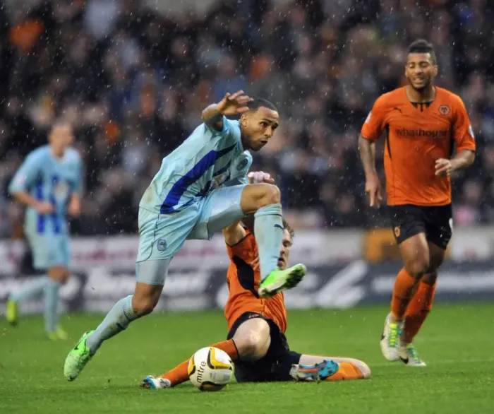 Framed Print : Intense Rivalry: McDonald vs. Wilson - Wolves vs. Coventry City Battle for the Ball (Sky Bet League 1) Framed Print : Intense Rivalry: McDonald vs. Wilson - Wolves vs. Coventry City Battle for the Ball (Sky Bet League 1)