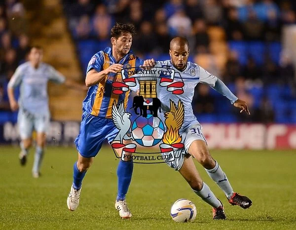 Intense Rivalry: McGoldrick vs Jacobson's Battle for Ball in Coventry City's Npower League One Clash (September 18, 2012)