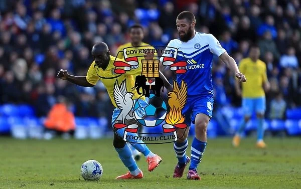 Intense Rivalry: Odelusi vs Bostwick's Battle for Ball Supremacy in Coventry City's Sky Bet League One Clash with Peterborough United