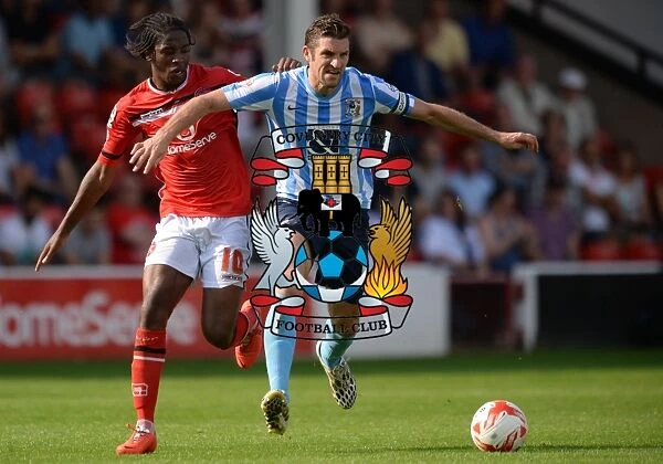 Intense Rivalry: Sam Ricketts vs. Romaine Sawyers Clash in Coventry City's Sky Bet League One Match at Walsall
