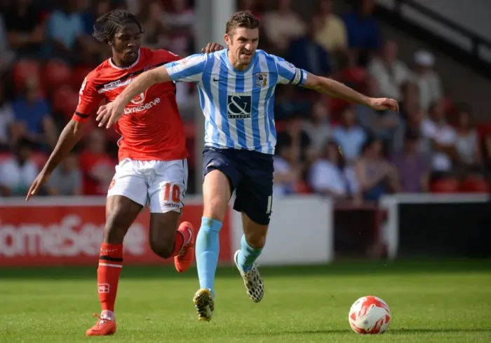 Framed Print : Intense Rivalry: Sam Ricketts vs. Romaine Sawyers Clash in Coventry City's Sky Bet League One Match at Walsall Framed Print : Intense Rivalry: Sam Ricketts vs. Romaine Sawyers Clash in Coventry City's Sky Bet League One Match at Walsall