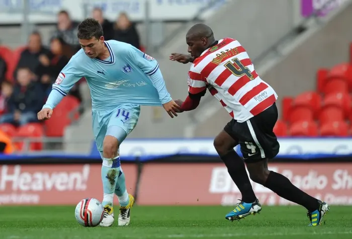 Framed Print : Intense Rivalry: Shelton Martis vs. Cody McDonald's Battle for Supremacy in Coventry City's Championship Clash at Doncaster Rovers Framed Print : Intense Rivalry: Shelton Martis vs. Cody McDonald's Battle for Supremacy in Coventry City's Championship Clash at Doncaster Rovers