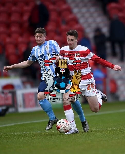 Intense Rivalry: Tommy Rowe vs. Aaron Phillips Battle in Coventry City's Sky Bet League One Clash at Doncaster Rovers (Season 2015-16)