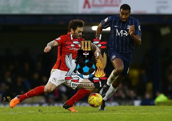 Intense Rivalry: Vincelot vs. Barnett Clash in Coventry City's Sky Bet League One Match at Roots Hall