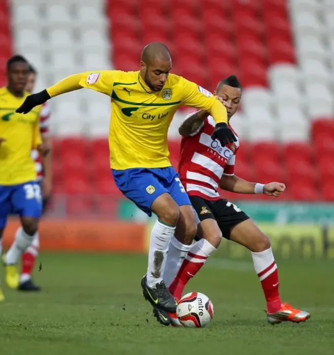 Framed Print : Intense Tackle: David McGoldrick vs Kyle Bennett in Npower League One Clash (Keepmoat Stadium, 15-12-2012) Framed Print : Intense Tackle: David McGoldrick vs Kyle Bennett in Npower League One Clash (Keepmoat Stadium, 15-12-2012)