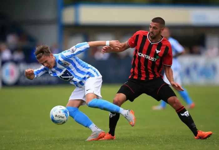 Framed Print : James Maddison Evasively Dodges Liam Secombe's Tackle in Coventry City's Pre-Season Friendly against Oxford United Framed Print : James Maddison Evasively Dodges Liam Secombe's Tackle in Coventry City's Pre-Season Friendly against Oxford United