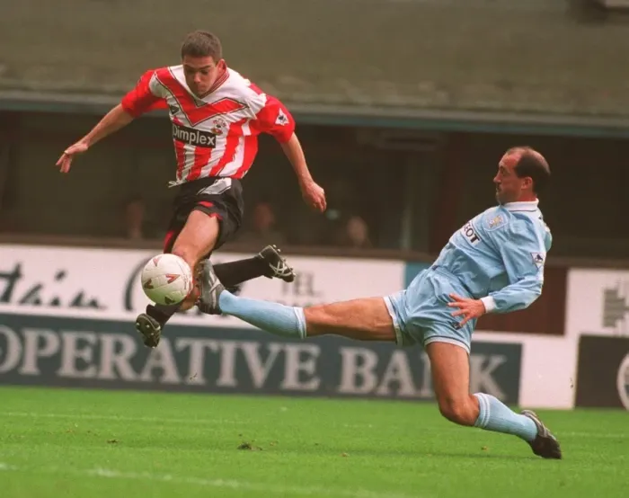 Framed Print : Jeff Kenna vs. David Rennie: A Battle of Football Giants Framed Print : Jeff Kenna vs. David Rennie: A Battle of Football Giants