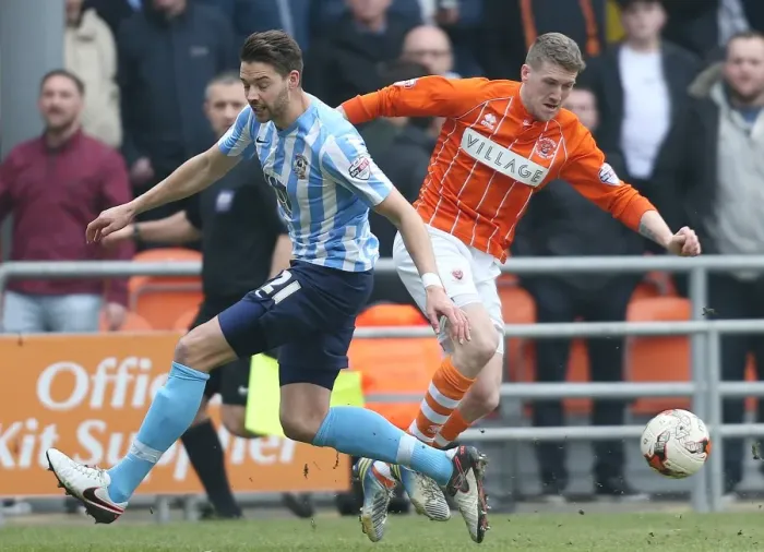 Framed Print : Jim McAlister vs Aaron Martin: A Battle in the Sky Bet League One Clash between Blackpool and Coventry City at Bloomfield Road Framed Print : Jim McAlister vs Aaron Martin: A Battle in the Sky Bet League One Clash between Blackpool and Coventry City at Bloomfield Road