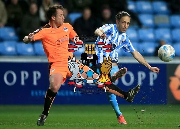 Jodi Jones of Coventry City Crossing Under Pressure from Nicky Shorey of Colchester United in Sky Bet League One Match at Ricoh Arena