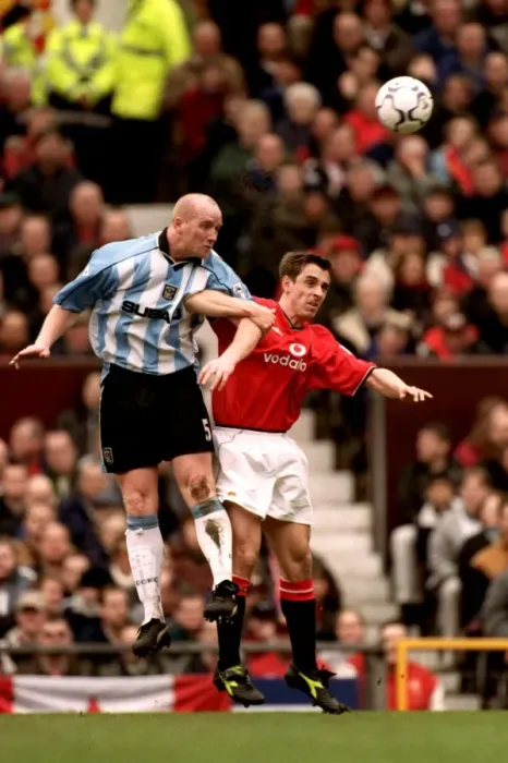 Framed Print : John Hartson's Epic Jump Over Gary Neville: Coventry City vs. Manchester United (Premier League, 2001) Framed Print : John Hartson's Epic Jump Over Gary Neville: Coventry City vs. Manchester United (Premier League, 2001)