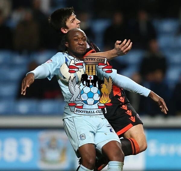 Johnstones Paint Trophy Quarter-Final: Coventry City vs Sheffield United Showdown at Ricoh Arena - Clash between Edjenguele and Maguire