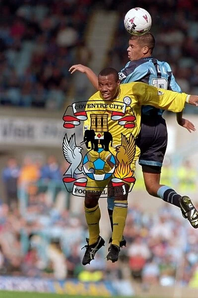 Leap of Faith: Wallace vs. Hall - Intense Battle for the Ball in Coventry City vs. Leeds United (1990s)
