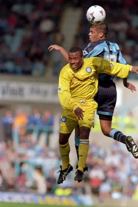 Framed Print : Leap of Faith: Wallace vs. Hall - Intense Battle for the Ball in Coventry City vs. Leeds United (1990s)