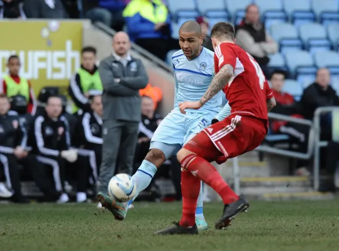 Framed Print : Leon Clarke vs Aden Flint: Intense Rivalry in Coventry City vs Swindon Town League One Clash at Ricoh Arena Framed Print : Leon Clarke vs Aden Flint: Intense Rivalry in Coventry City vs Swindon Town League One Clash at Ricoh Arena