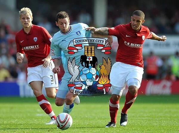 Lucas Jutkiewicz vs. Nathan Doyle: A Championship Battle at Oakwell Stadium - Coventry City vs. Barnsley (2011)