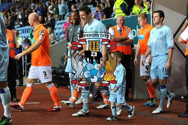Lukas Jutkiewicz and Mascot Leading Coventry City Out at Ricoh Arena vs Blackpool (Npower Football League Championship, 27-09-2011)