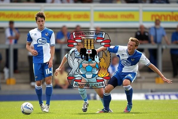 McSheffrey vs. Clucas: A Battle for the Ball in Coventry City's Pre-Season Clash with Bristol Rovers