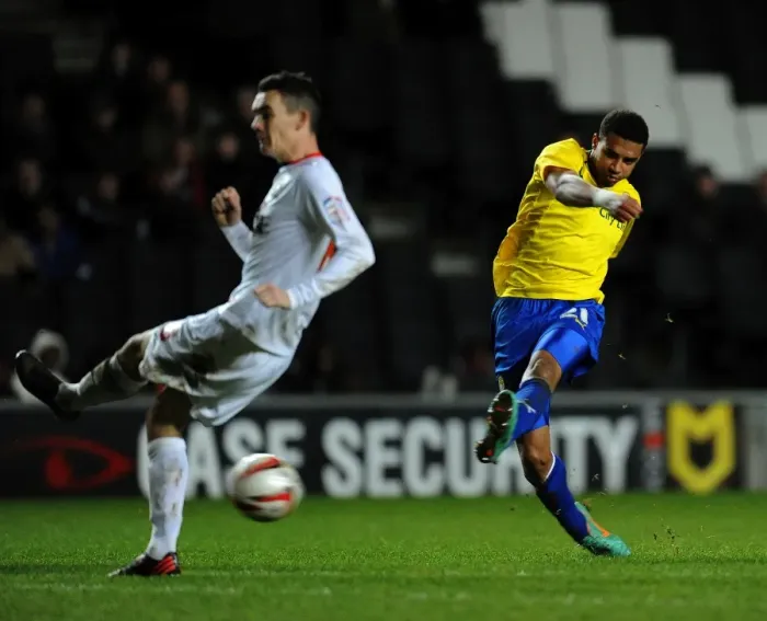 Framed Print : Milton Keynes Dons Shaun Williams Dodges Cyrus Christie's Shot in Npower League One Clash (December 29, 2012) Framed Print : Milton Keynes Dons Shaun Williams Dodges Cyrus Christie's Shot in Npower League One Clash (December 29, 2012)