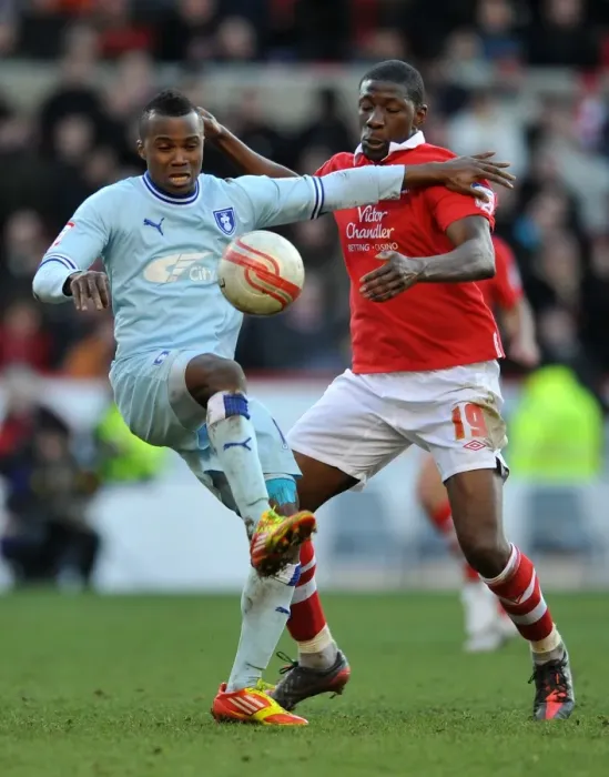Framed Print : Moussi vs. Nimely: A Championship Showdown - Intense Rivalry between Coventry City's Alex Nimely and Nottingham Forest's Guy Moussi (18-02-2012, City Ground) Framed Print : Moussi vs. Nimely: A Championship Showdown - Intense Rivalry between Coventry City's Alex Nimely and Nottingham Forest's Guy Moussi (18-02-2012, City Ground)